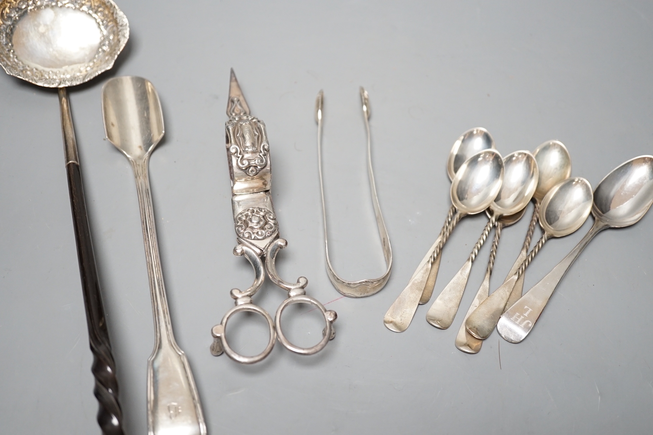 A Victorian silver fiddle and thread pattern stilton scoop, George Adams, London, 1852, 22.3cm, a small group of silver flatware and a plated toddy ladle and pair of candle snuffers.